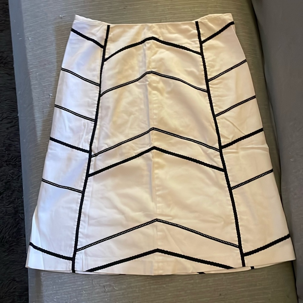 White and black below knee skirt